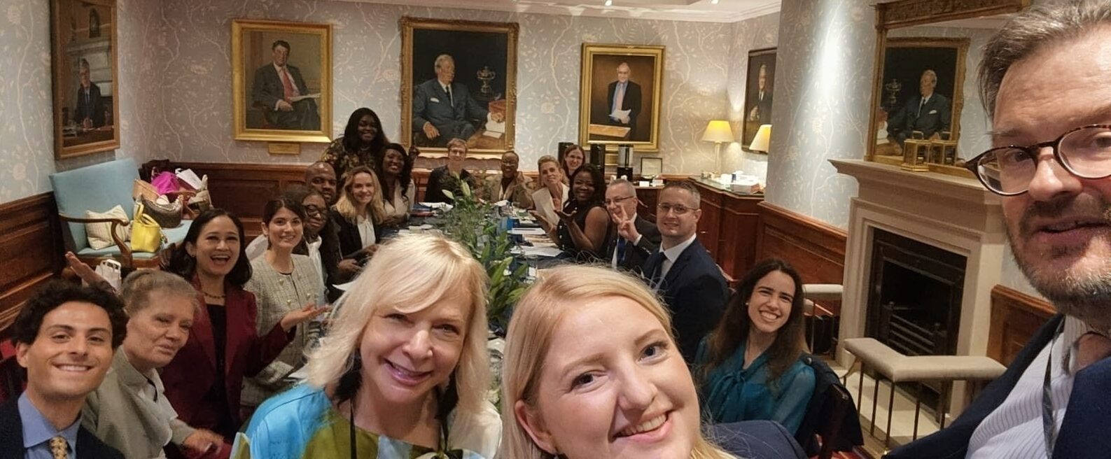 Delegates gathered around the boardroom table in London