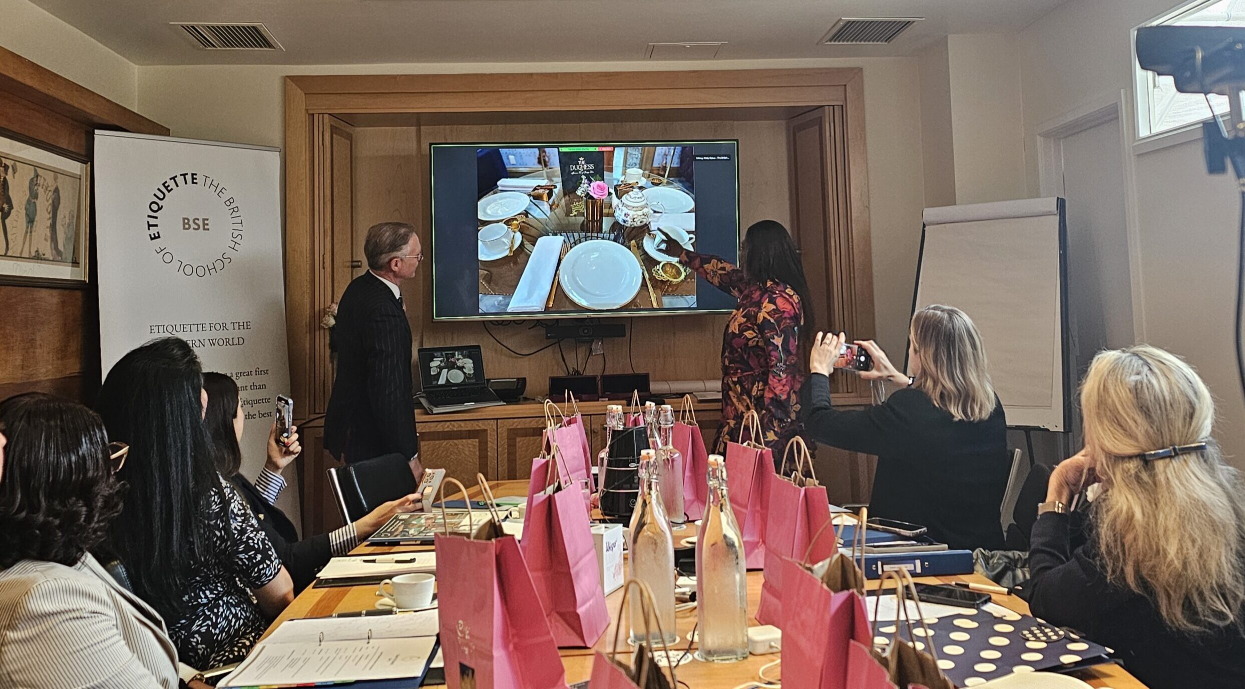 A trainer presenting the formal place setting