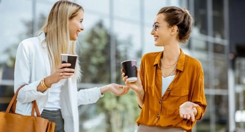 Two professional women making small talk